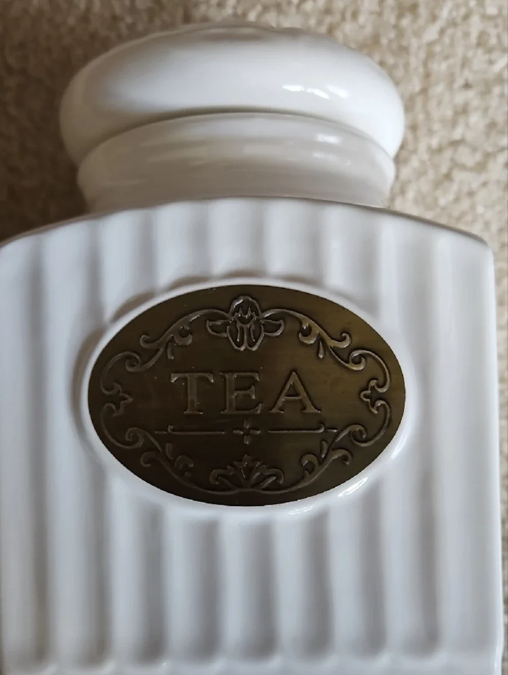 Elegant White Ceramic Tea Canister and Teapot Set with Brass Accents